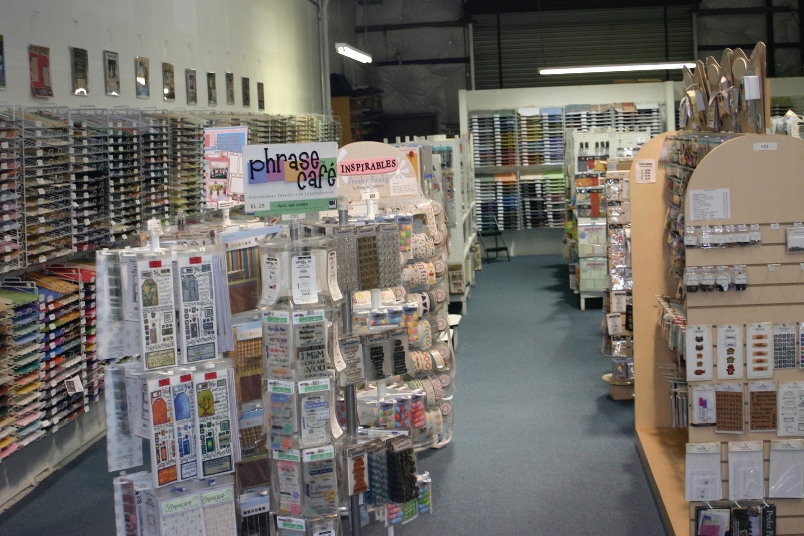 Aisles of scrapbook paper, stamps, and supplies inside the dMarie Direct warehouse store